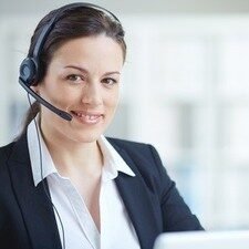 Young customer support representative looking at camera with smile